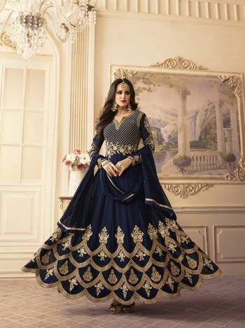 Give A Rich Look To Your Personality With This Beautiful Color. This Lovely Designer Floor Length Suit Is In Navy Blue Color Paired With Navy Blue Colored Bottom And Dupatta. Its Top Is Fabricated On Georgette Paired With Santoon Bottom And Chiffon Dupatta. This Semi-Stitched Suit HAs Beautiful Attractive Embroidery Over The Yoke And Panel Of The Suit. Buy It Now.