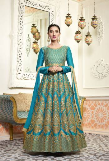 Go With The Cool Color Palette With This Designer Floor Length Suit In Blue Color Paired With Blue Colored Bottom And Dupatta. Its Top Is Fabricated On Art Silk Paired With Santoon Bottom And Chiffon Dupatta. This Lovely Gown Suit Will Definetily Earn You Lots Of Compliments From Onlookers.