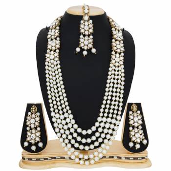 Queen Look Is Here When Your Pair With This Necklace Set With Your Traditional Attire. This White Colored Necklace Set Is Beautified With Stones And Pearls Which Is Evergreen And Suits With Any Kind Of Attire. Buy Now.