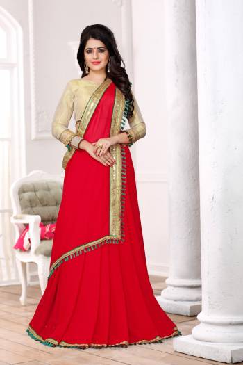 Adorn The Angelic Look Wearing This Red Colored Saree Paired With Golden Colored Blouse. This Saree Is Fabricated On Georgette Paired With Brocade Fabricated Blouse. It Is Light In Weight And Ensures Superb Comfort All Day Long.