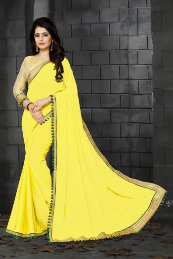 Celebrate This Festive Season With Ease And Comfort Wearing This Lovely Yellow Colored Saree Paired With Golden Colored Blouse. This Saree Is Fabricated On Georgette Paired With Golden Colored Blouse. This Saree Ensures Superb Comfort Throughout the Gala And Also Gives You An Elegant Look.