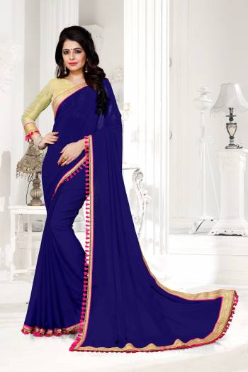 You Will Definitely Earn Lots Of Compliments From Onlookers Wearing This Lovely Saree In Blue Color Paired With Golden Colored Blouse. This Saree Is Fabricated On Georgette Paired With Brocade Fabricated Blouse. It Ensures Superb Comfort All Day Long And Also It Is Durable. 