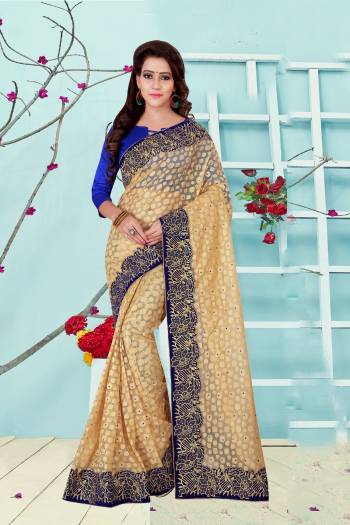 Light Weight And Comfortable Saree Is Here In Cream Color Paired With Royal Blue Colored Blouse. This Saree Is Fabricated On Net Paired With Art Silk Fabricated Blouse. It Is Light In Weight And Also Easy To Carry All Day Long. Buy Now.