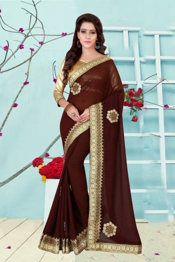 Earn Lots Of Compliments Wearing This Saree In Brown Color Paired With Golden Colored Blouse. This Saree Is Fabricated On Georgette Paired With Art Silk Fabricated Blouse. This Saree Is Beautified With Embroidered Lace Border. Buy This Saree Now.