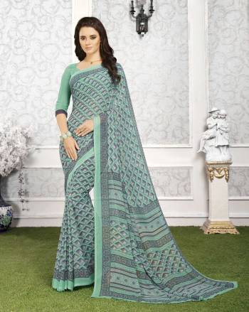 Go With This Pretty Shade Of Blue With This Saree In Aqua Blue Color Paired With Aqua Blue Colored Blouse. This Pretty Saree And Blouse Are Fabricated On Georgette Beautified With Simple Prints All Over It. Buy This Saree Now.