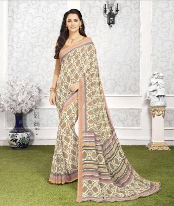 For Your Casual Wear Here Is A Printed Saree In Cream Color Paired With Light Brown Colored Blouse. This Saree And Blouse Are Fabricated On Georgette. This Saree Is Light In Weight And Easy To Carry All Day Long.