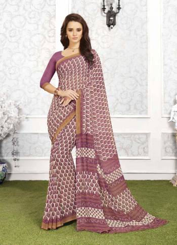 Look Pretty In This Lovely Shade Of Light Wine Colored Saree Paired With Light Wine Colored Blouse. This Saree And Blouse Are Fabricated On Georgette Beautified With All Over Prints. 