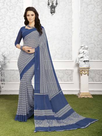 You Will Definetily Earn Lots Of Compliments Wearing This Rich Looking Grey And Blue Colored Saree Paired With Blue Colored Blouse. This Saree And Blouse Are Fabricated On Georgette Beautified With Prints All Over It. Buy This Saree For Your Regular Wear Now.