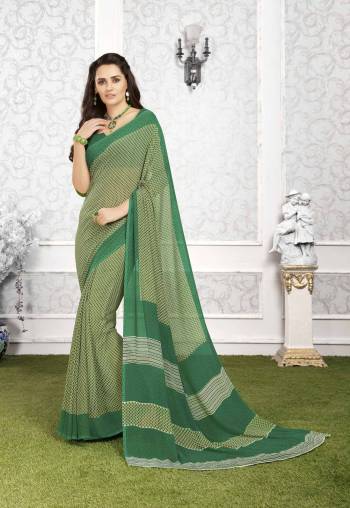 More Simple You Look, More Elegant It Will Be. Grab This Simple Green Colored Saree Paired With Dark Green Colored Blouse. This Saree And Blouse Are Fabricated On Georgette Beautified With Prints All Over It. It Is Light In Weight And Easy To Carry All Day Long. 