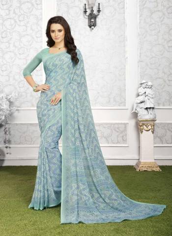 Go With This Pretty Shade Of Blue With This Saree In Baby Blue Color Paired With Baby Blue Colored Blouse. This Pretty Saree And Blouse Are Fabricated On Georgette Beautified With Simple Prints All Over It. Buy This Saree Now.