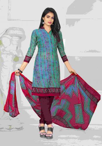 For Your Casual Wear Grab This Dress Material In Sea Green Color Paired With Contrasting Magenta pink Colored Bottom And Multi Colored Dupatta. Its Top And Bottom Are Fabricated On Cotton Paired With Chiffon Dupatta. It Is Light In Weight And Easy To Carry All Day Long.