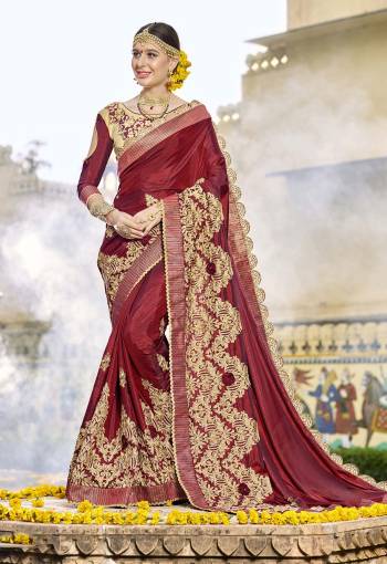 Have A Beautiful Heavy Look Wearing This Saree In Maroon Color Paired With Beige Colored Blouse. This Saree Is Fabricated On Satin Silk Paired With Art Silk Fabricated Blouse. It Is Beautified With Heavy Embroidery. Buy This Designer Saree Now.