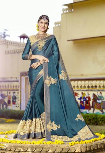 New And Unique Shade Is Here With This Lovely Saree In Teal Blue Color Paired With Teal Blue Colored Blouse. This Saree Is Fabricated On Satin Georgette Paired With Art Silk Fabricated Blouse. It Has Embroidered Patch Work Over The Pretty Designer Saree.