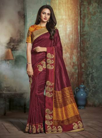 Rich And Elegant Looking Saree Is Here In Maroon Color Paired With Contrasting Orange Colored Blouse. This Saree And Blouse Are Fabricated On art Silk Which Is Easy To Drape And Carry All Day Long.