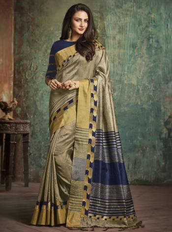 Flaunt Your Rich And Elegant Taste Wearing This Saree In Grey Color Paired With Contrasting Navy Blue Colored Blouse, This Saree And Blouse Are Fabricated On Art Silk Which Gives A Rich Look To Your Personality. Buy This Saree Now.