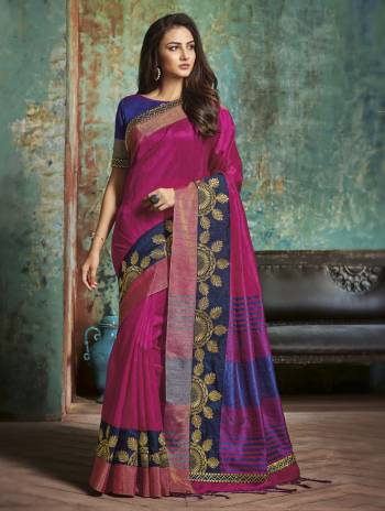 Shine Bright Wearing This Saree In Dark Pink Color Paired With Contrasting Royal Blue Colored Blouse. This Saree And Blouse Are Fabricated On Art Silk And It Will Definitely Earn You Lots Of Compliments From Onlookers. 