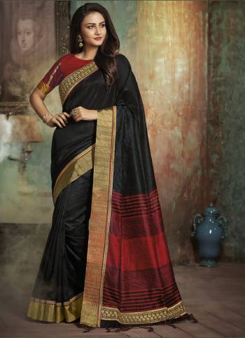 Enhance Your Beauty Wearing This Saree In Black Color Paired With Contrasting Red Colored Blouse. This Saree And Blouse Are Fabricated On Art Silk Bautified With Embroidered Lace Border. Buy This Saree Now.