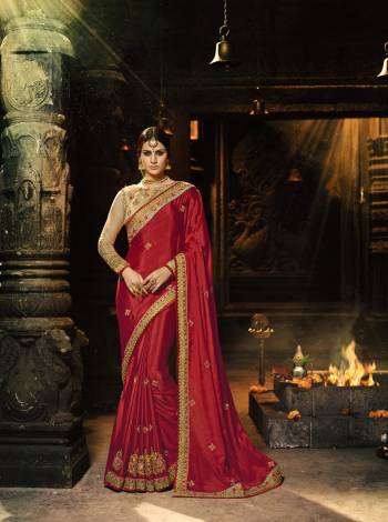 Adorn The Beautiful Angelic Look Wearing This Saree In Red Color Paired With Beige Colored Blouse. This Saree Is Fabricated On Silk Chiffon Paired With Art Silk And Net Fabricated Blouse. It Has Beautiful Embroidery Over The Saree And Blouse, Also It Is Light In Weight And Easy To Carry All Day Long.