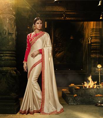 Simple and Elegant Looking Saree Is Here In Cream Color Paired With Red Colored Blouse. This Saree Is Fabricated On Soft Silk Paired With Art Silk Fabricated Blouse, Beautified With Embroidered Lace Border And Heavy Embroidred Blouse. 