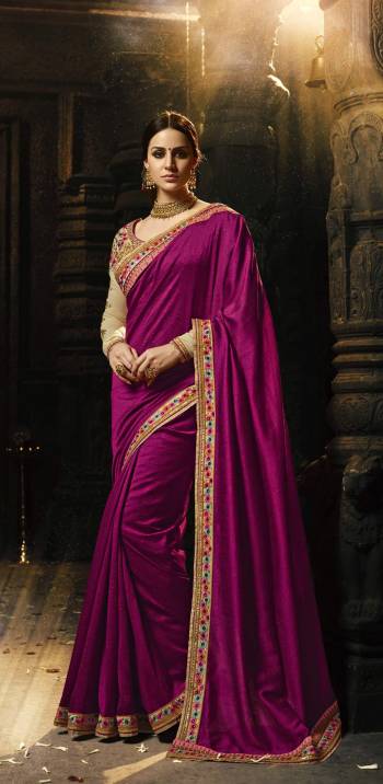 Attract All Wearing This Attractive Colored Saree In Magenta Pink Color Paired With Beige Colored Blouse. This Saree And Blouse Are Fabricated On Art Silk Beautified With Multi Colored Embroidery Over The Blouse And Saree. Buy This Saree Now.