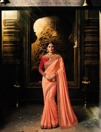 Most Demanding Color Of The Season Is Here In Peach Color Paired With Contrasting Red Colored Blouse. This Saree And Blouse Are Fabricated On Art Silk Fabricated Blouse. This Color Combination Will Earn You Lots Of Compliments From Onlookers. Buy This Saree Now.