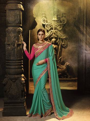 Celebrate This Festive Season Wearing This Saree In Turquoise Blue Color Paired With Contrasting Dark Pink Colored Blouse. This Saree Is Fabricated On Soft Silk Paired With Art Silk And Georgette Fabricated Blouse. Its Attractive Design And Color Will Earn You Lots Of Compliments From Onlookers. Buy Now.