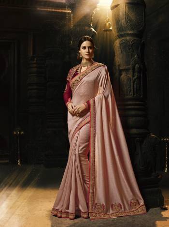 This Season Is About Pastel Play And Subtle Shades So Grab This Saree In Subtle Dusty Pink Color Paired With Contrasting Maroon Colored Blouse. This Saree Is Fabricated On Art Silk Paired With Art Silk And Net Fabricated Blouse. Its Pretty Unique Shade And Combination Will Earn You Lots Of Compliments From Onlookers.