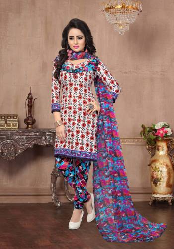 Go Colorful Wearing This Suit In White And Red Colored Top Paired With Multi Colored Bottom And Dupatta. Its Top And Bottom Are Fabricated On American Crepe Paired With Chiffon Dupatta. Get This Dress Material Stitched As Per Your Desired Fit And Comfort.