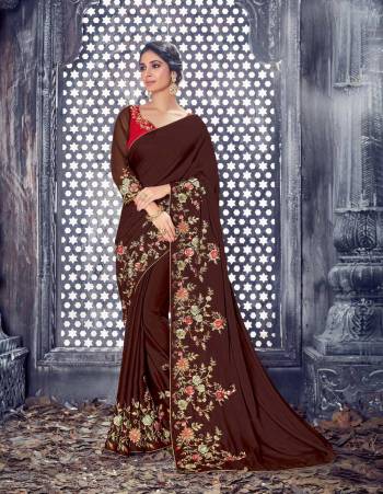 Look Graceful Wearing This Designer Brown Colored Saree Paired With Contrasting Red Colored Blouse. This Saree And Blouse Are Fabricated On Art Silk Beautified With Thread Work Over The Border And Blouse. Buy It Now.