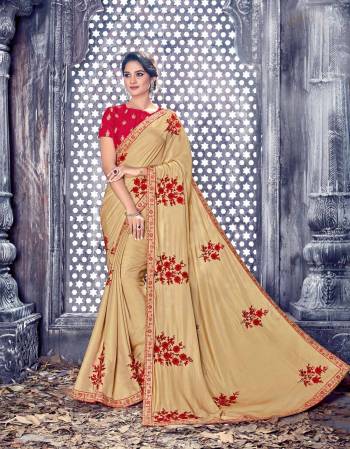 Flaunt Your Rich and Elegant Taste Wearing This Saree In Beige Color Paired With Red Colored Blouse. This Saree And Blouse Are Fabricated On Art Silk. It Is Beautified With Red Colored Embroidery Which Is Giving An Attractive Look To The Saree. Buy Now.