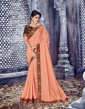 Beautiful Combintion Is Here With This Designer Saree In Peach Color Paired With Contrasting Brown Colored Blouse. This Saree And Blouse Are Fabricated On Art Silk Beautified With Attractive Embroidered Lace Border And Embroidery Over The Blouse. 