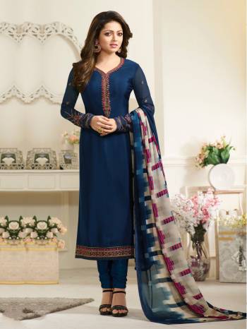 For Bold And Beautiful Personality, Grab This Designer Straight Cut Suit In Navy Blue Color Paired With Navy Blue Colored Bottom And Grey And Blue Dupatta.  Its Top Is Fabricated On Crepe Paired With Satin Silk Bottom And Chiffon Dupatta. It Is Light Weight And Easy To Carry All Day Long.