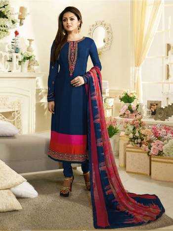 Here Is A Perfect Suit For Your Semi-Casual Wear In Blue Color Paired With Blue Colored Bottom And Pink And Blue Dupatta. Its Top Is Fabricated On Crepe Paired With Satin Silk Bottom And Chiffon Dupatta. Its All Three Fabrics Ensures Superb Comfort All Day Long.