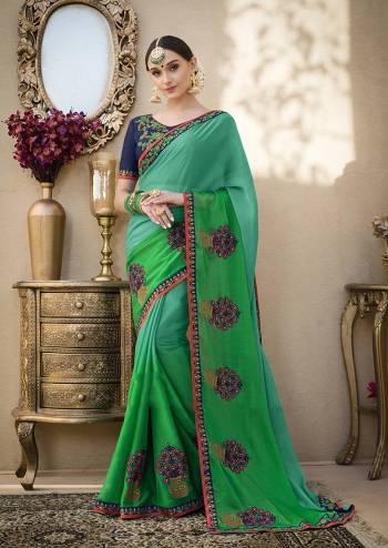 Cool Colored Pallete Saree Is Here In Blue And Green Color Paired With Navy Blue Colored Bloue. This Saree Is Fabricated On Chiffon Paired With Art Silk Fabricated Blouse. It Is Beautified With Contrasting Embroidery Over The Saree And  Blouse. 