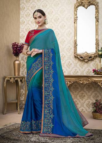 Go With This Shades Of Blue With This Shaded Saree In Blue Color Paired With Contrasting Red Colored Blouse. This Saree Is Fabricated On Chiffon Paired With Art Silk Fabricated Blouse. It Is Light Weight And Easy To Carry Throughout The Gala. Buy Now.