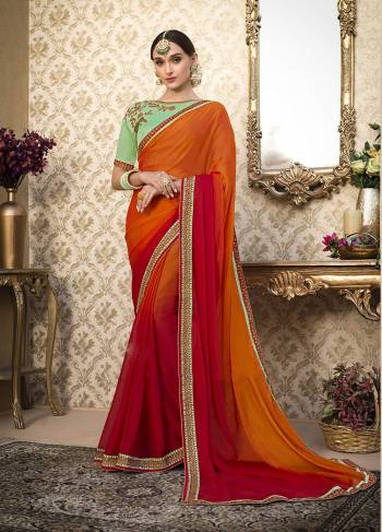 For A Proper Tradirtonal Wear, Grab This Designer Saree In Orange And Red Color Paired With Contrasting Light Green Colored Blouse. This Saree Is Fabricated On Chiffon Paired With Art Silk Fabricated Blouse. Buy This Saree Now.