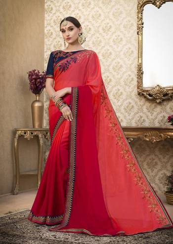 Celebrate This Festive Season Wearing This Saree In Shades OF Red Paired With Contrasting Navy Blue Colored Blouse. This Saree Is Fabricated On Chiffon Paired With Art Silk Fabricated Blouse. It Is Light Weight And Easy To Carry All Day Long. Buy Now.