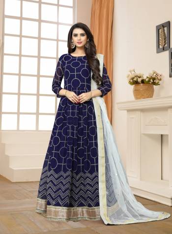 Enhance Your Personality Wearing This Navy Blue Colored Floor Length Suit Paired With Navy Blue Colored Bottom And White Colored Dupatta. Its Top Is Fabricated On Georgette Paired With Santoon Bottom And Net Dupatta. This Suit Will  Earn You Lots Of Compliments From Onlookers.