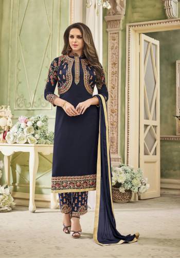 Give An Attractive Look To Your Personality Wearing This Designer Straight Cut Suit In Navy Blue Color Paired With Navy Blue Colored Bottom And Dupatta. Its Top Is Fabricated On Georgette Paired With Santoon Bottom And Chiffon Dupatta. It Is Beautified With Multi Coolored Embroidery Over The Top and Bottom. buy Now.