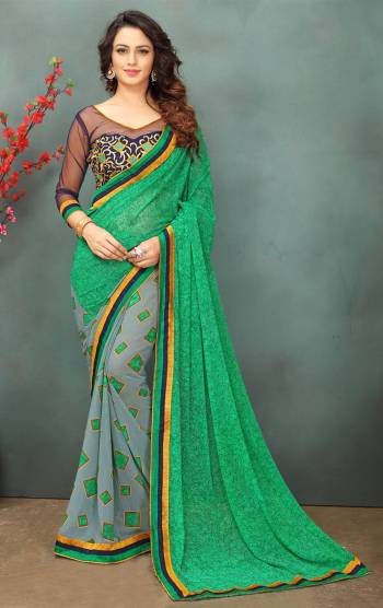 For Your Semi-Casual Wear, Grab This Saree In Green and Grey Color Paired With Navy Blue Colored Blouse. This Saree Is Fabricated On Georgette Paired With Art Silk And Net Fabricated Blouse. Saree Is Beautified With Prints And Blouse With Thread Embroidery.