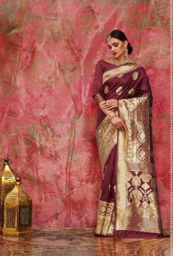 Add This Lovely Color To Your Wardrobe In Silk Saree With This Pretty Wine Colored Saree Paired With Wine Colored Blouse. This Saree And Blouse Are Fabricated On Banarasi Art Silk Beautified With Weave All Over. It Is Light Weight And Easy To Drape. Buy Now.