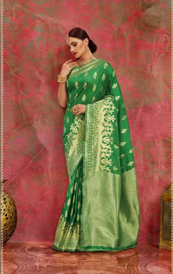 Grab This Silk Saree In Green Color Paired With Green Colored Blouse. This Saree And Blouse Are Fabricated On Banarasi Art Silk. It Gives And Rich And Attractive Look To Your Personality. Buy Now.