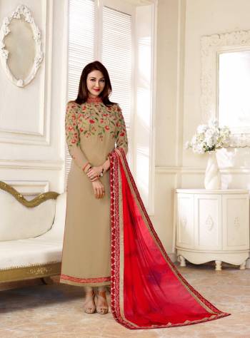 Elegant Looking Designer Straight Cut Suit Is Here In Beige Color Paired With Beige Colored Bottom And Red Colored Dupatta. Its Top Is Fabricated On Georgette Paired With Santoon Bottom And Chiffon Dupatta. It Has Beautifful Embroidery Over The Neck Which will Give An Unqiue Look To Your Personality. 