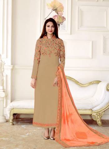 Simple and Elegant Staright Cut Suit Is Here In Beige Colored Top Paired With Beige Colored Bottom And Orange Colored Dupatta. Its Top Is Fabricated On Georgette Paired With Santoon Bottom And Chiffon Dupatta. It Is Light Weight And Easy To Carry All Day Long. Buy Now.