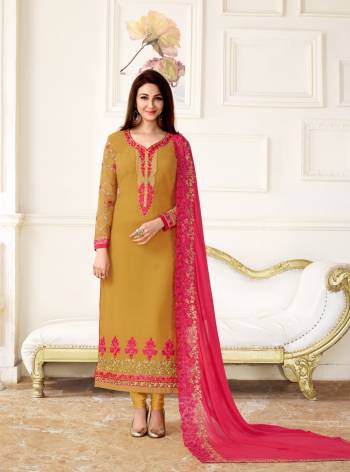 Celebrate This Festive Season With Beauty And Comfort Wearing This Designer Straight Cut Suit In Musturd Yellow Color Paired With Musturd Yellow Colored Bottom And Contrasting Dark Pink Colored Dupatta. Its Top Is Fabricated On Georgette Paired With Santoon Bottom And Chiffon Dupatta. Buy It Soon Before The Stock Ends.