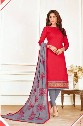 Here Is A Very Pretty Combination In Red Colored Top Paired With Contrasting Grey Colored Bottom And Dupatta. Its Top and Bottom Are fabricated On Cotton Paired With Chiffon Dupatta.Get This Dress Material Stitched And Wear This At Your Workplace Or Home. Buy Now.