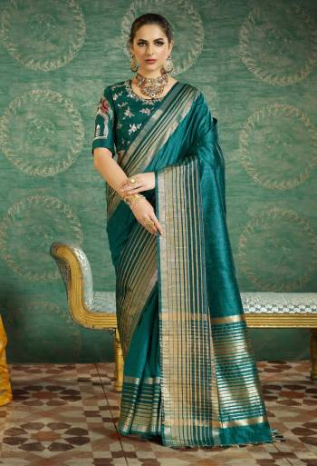 Add This Lovely Shade Of Blue To Your Wardrobe With This Saree In Teal Blue Color Paired With Teal Blue Colored Blouses. This Saree Is Fabricated On Handloom Art Silk Paired With Art Silk Fabricated Blouse And Another Blouse Is Fabricated On Handloom Art Silk. Buy This Designer Saree Now.