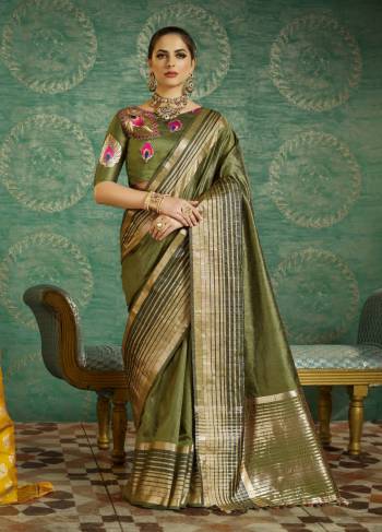 One Of The Favourite Shade In Green Is Here With This Designer Saree In Olive Green Color Paired With Two Blouses In Olive Green Color. This Saree And Blouse Are fabricated On Handloom Art Silk And Another Embroidered Blouse Is Fabricated On Art Silk. Buy This Saree Now.