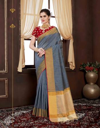 Flaunt Your Rich And Elegant Taste Wearing This Saree In Grey Color Paired With Contrasting Red Colored Blouse. This Saree Is Fabricated On Handloom Weaving Silk Paired With Art Silk Fabricated Embroidered Blouse. Its Lovely Combination Will Earn You Lots Of Compliments From Onlookers.