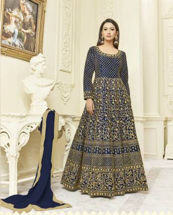 Full Embroidered Designer Suit In Here In Navy Blue Color Paired With Navy Blue Colored Bottom And Dupatta. Its Top Is Fabricated On Art Silk Paired With Santoon Bottom And Chiffon Dupatta. It Has eavy Embroidery All Over The Top. Buy Now.